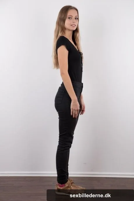Tall teen Eliska stands totally naked while making her nude modeling debut