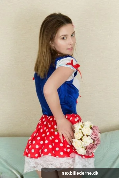 Nice teen Stella puts down a bouquet of flowers before getting naked