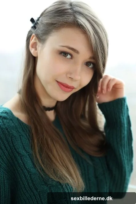 Beautiful teen frees her natural tits from a sweater before spreading her twat