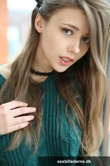 Beautiful teen frees her natural tits from a sweater before spreading her twat