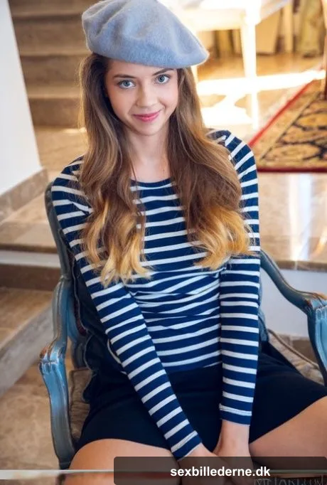 Charming teen Kay J flashes her polkadot underwear before getting bare naked