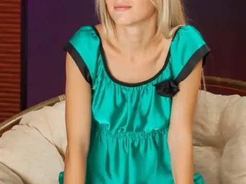 Blonde beauty Xena spreads her hot pussy in a chair and show