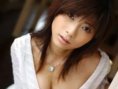 Beautiful Japanese girl Rin Suzuka lets a firm breast loose during solo action